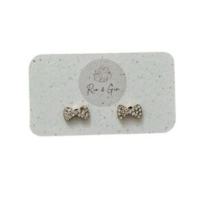 Dainty pave gold bow stud earrings